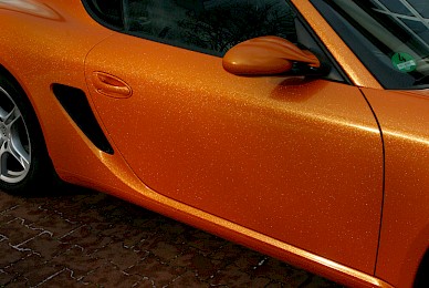 Vollverklebung Porsche Cayman Von Dunkelblau In Orange Glitzer Und Schwarz Matt