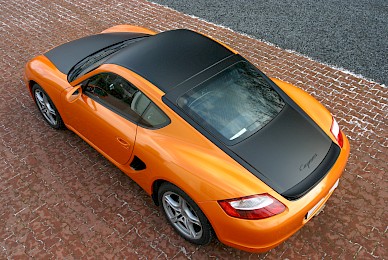 Vollverklebung Porsche Cayman Von Dunkelblau In Orange Glitzer Und Schwarz Matt