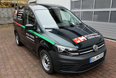 Vollverklebung Vw Caddy In Sonderfarbe British Racing Green Metallic Und Beschriftung